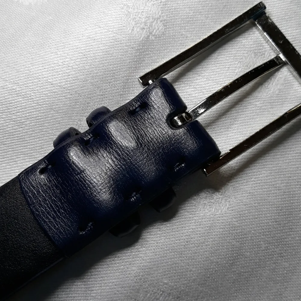 Calvin Klein dark blue leather belt. 34 inches long